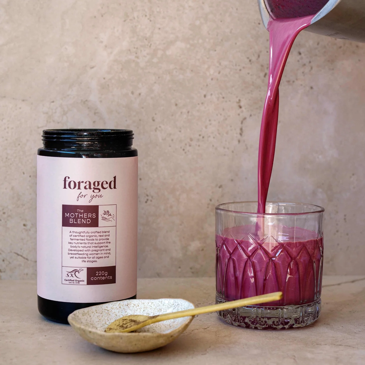 Foraged for You The Mothers Blend Powder powder and a prepared drink