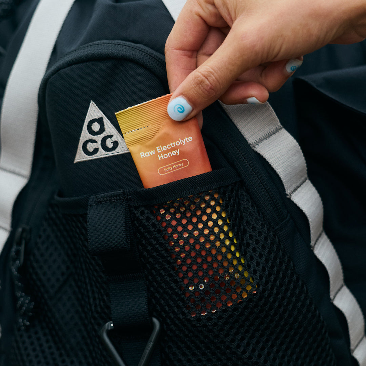 Sodii Raw Electrolyte Honey sachet carried in a running vest pocket