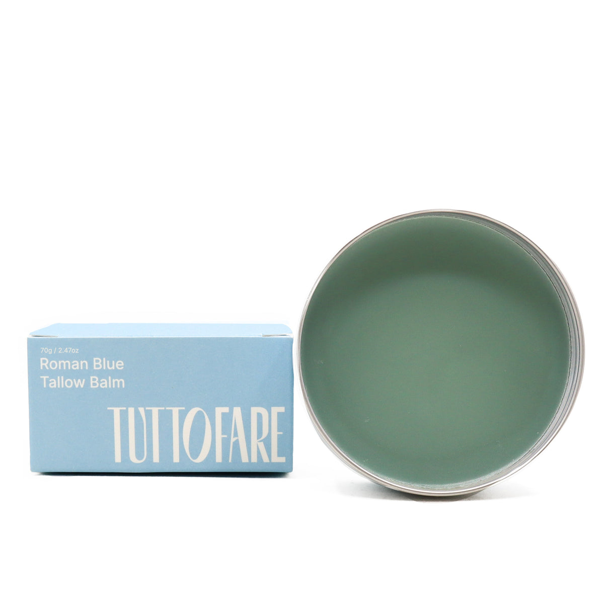Tuttofare Roman Blue Tallow Balm opened to reveal naturally blue-green balm texture beside box